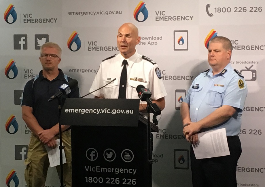 Kevin Parkyn,  Emergency Management Commissioner Andrew Crisp, Victorian SES Chief Operations Officer Tim Wiebusch front the microphone at a press conference